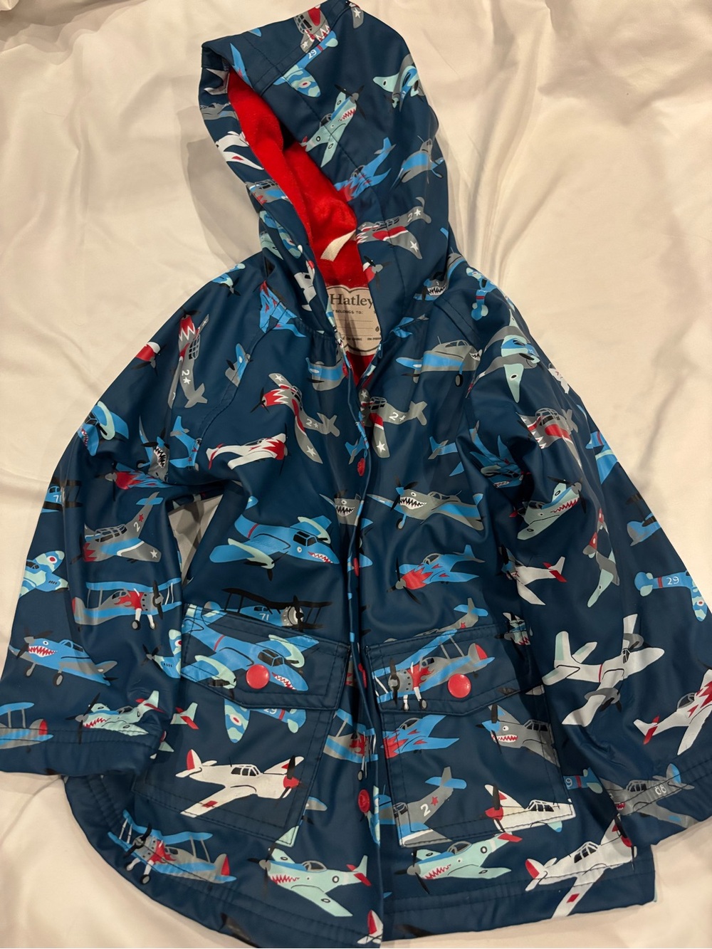 Hatley Navy Airplane Raincoat with Red Hood Lining and Blue Plane Print